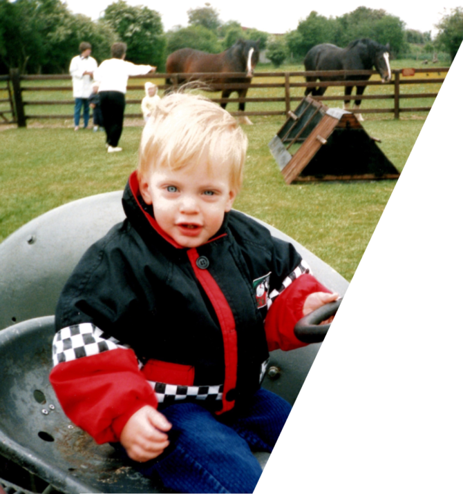 Toddler David on the tractor